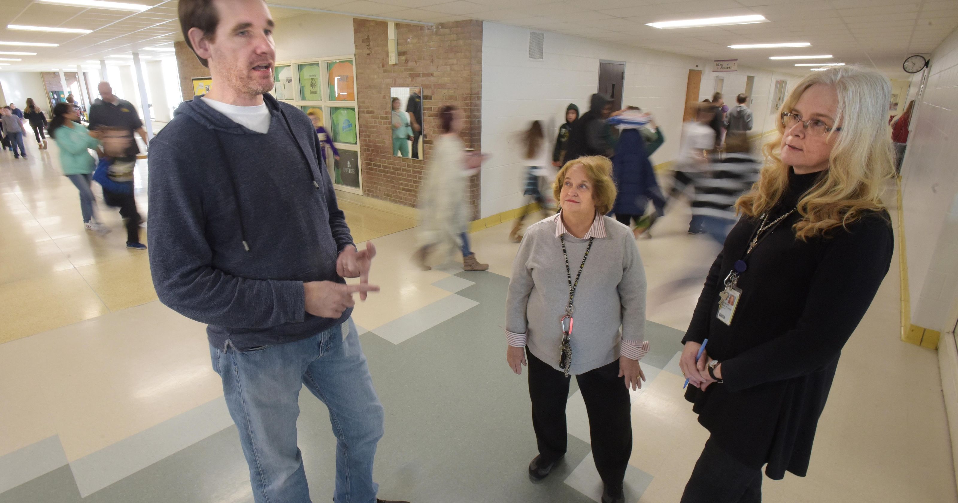 Pierce Middle School counselor Jeff Tunnicliff, left, Waterford truancy coordinator Becky Staab and Pierce Middle School counselor Annette Noble-Farmiloe discuss student absenteeism last week at Pierce in Waterford Township.