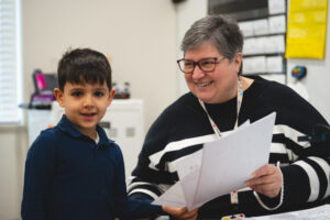 Mrs. Mills working with a student