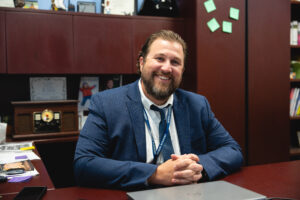 Mr. Sobczak Sitting at His Desk